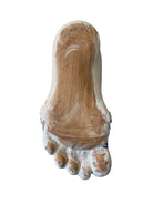 Ceramic foot sculpture by Domenico Pinto featuring hand-painted details, gold accents, a sacred heart, and an angel figure with a blindfold