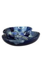 Vintage McCoy ashtray. Glazed in dark blue and marbled with lighter blues. The bottom is stamped 'McCoy USA.'"