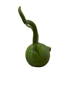 Glossy green ceramic pig sculpture with exaggerated, upward-curving horns and a snout.