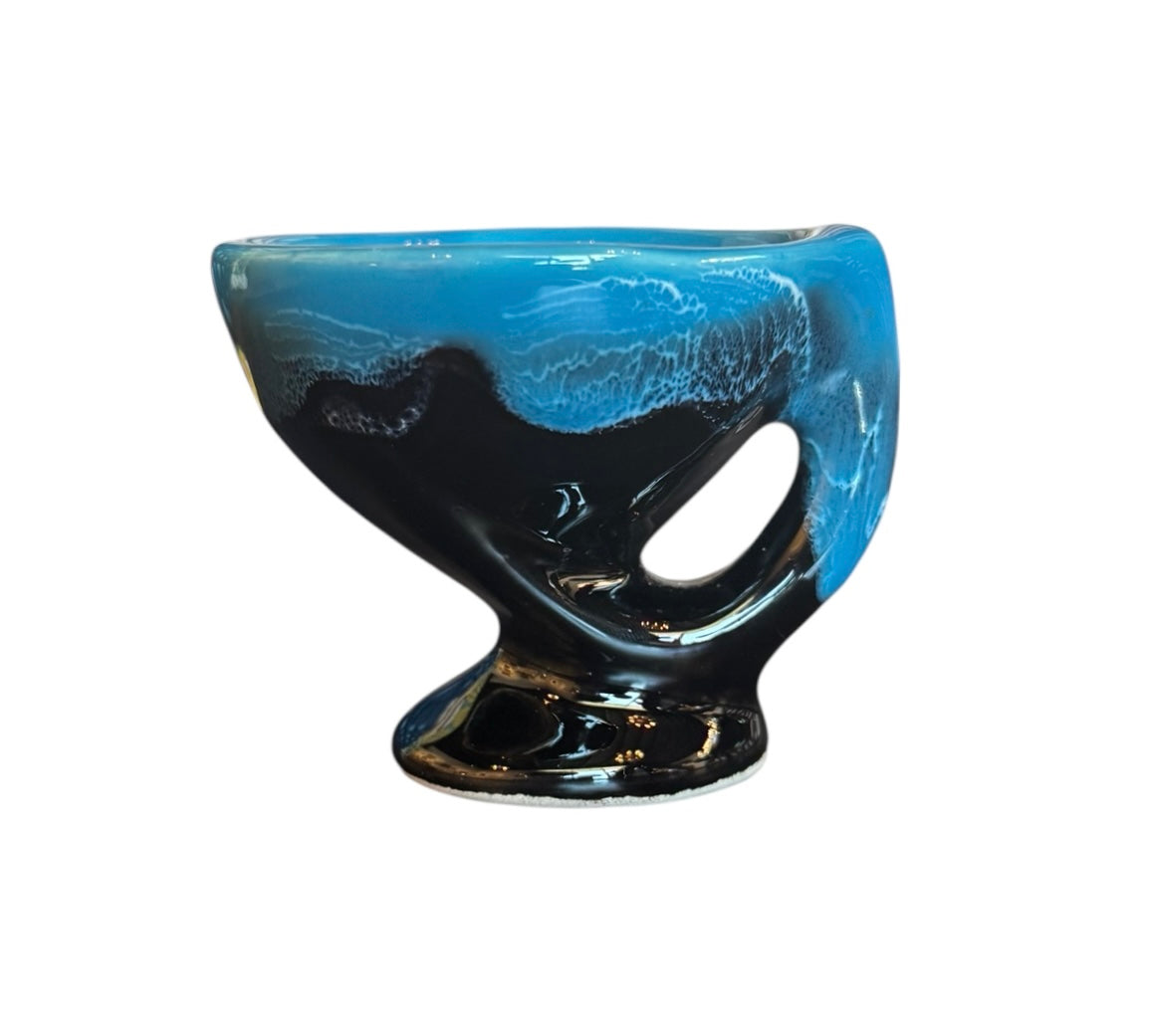 Complete mid-century ceramic tea set with teapot, sugar bowl, cups, and saucers, featuring a bold blue and black "lava drip" glaze reminiscent of Vallauris pottery.