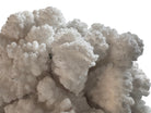 A dense, mounded white coral sculpture with a heavy, cauliflower-style growth pattern. The lobes are closely bunched together, covered in tiny, uniform bumps that give the piece a fuzzy or frosted visual texture.