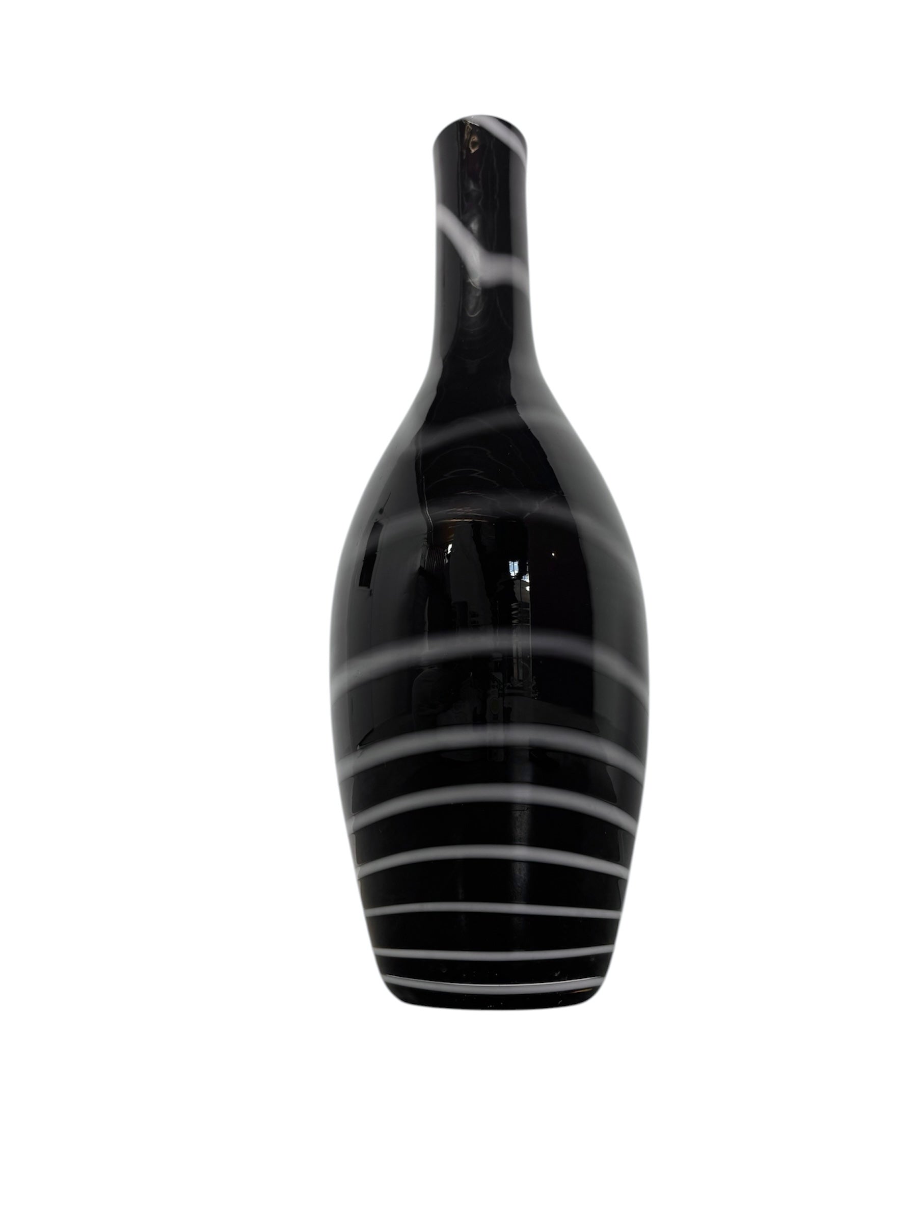 A sleek, hand-blown Polish art glass vase featuring a tall, slender neck that flares into a rounded, bulbous body. The vase is made of opaque black glass decorated with a continuous white spiral ribbon that winds around the entire piece from base to rim. The high-gloss, reflective surface creates sharp highlights, emphasizing its smooth, sculptural silhouette against a plain white background.
