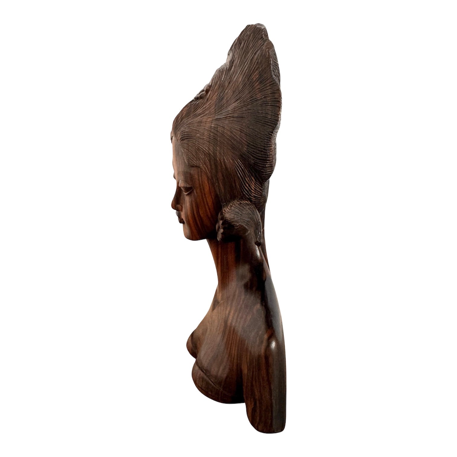An elegant hand-carved bust of a woman made from rich, polished dark ebony wood with striking reddish-brown grain patterns running vertically through her face and chest. The sculpture features a serene expression with closed eyes, a slender nose, and relaxed lips. Her voluminous, textured hair rises upward in a Fan-like shape, intricately carved with fine lines and adorned with small, delicate flower details. The bust includes her bare shoulders and upper chest, resting on a flat base.