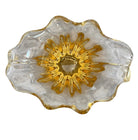 A hand-blown art glass vase with a scalloped, tulip-shaped rim, featuring an amber-to-clear color gradient and a ribbed base