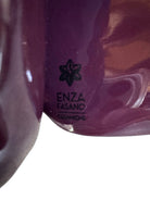 A glossy, dark chocolate brown ceramic bust of a Labrador dog. Created by Enza Fasano, the sculpture features a minimalist, stylized design with smooth, flowing lines and a high-shine glaze that reflects light. The dog’s long ears drape down the sides, and its snout is rounded, capturing the gentle essence of the breed in a contemporary Italian pottery style.