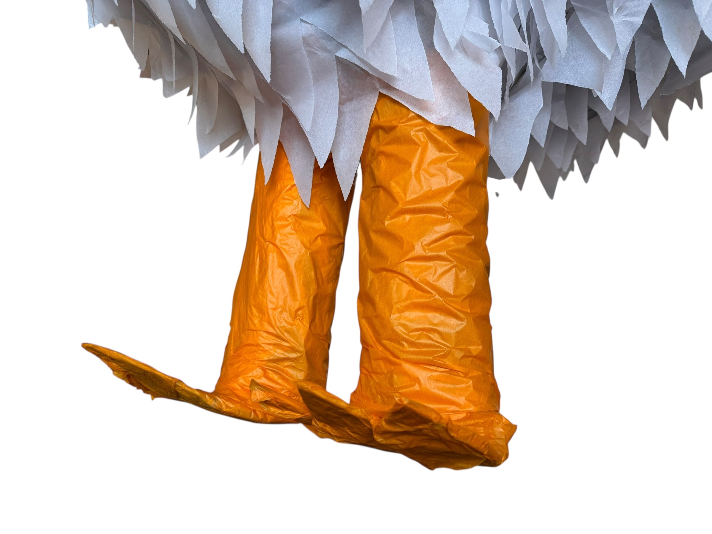 A white chicken pinata with red comb and wattles, and orange beak and legs, standing upright.