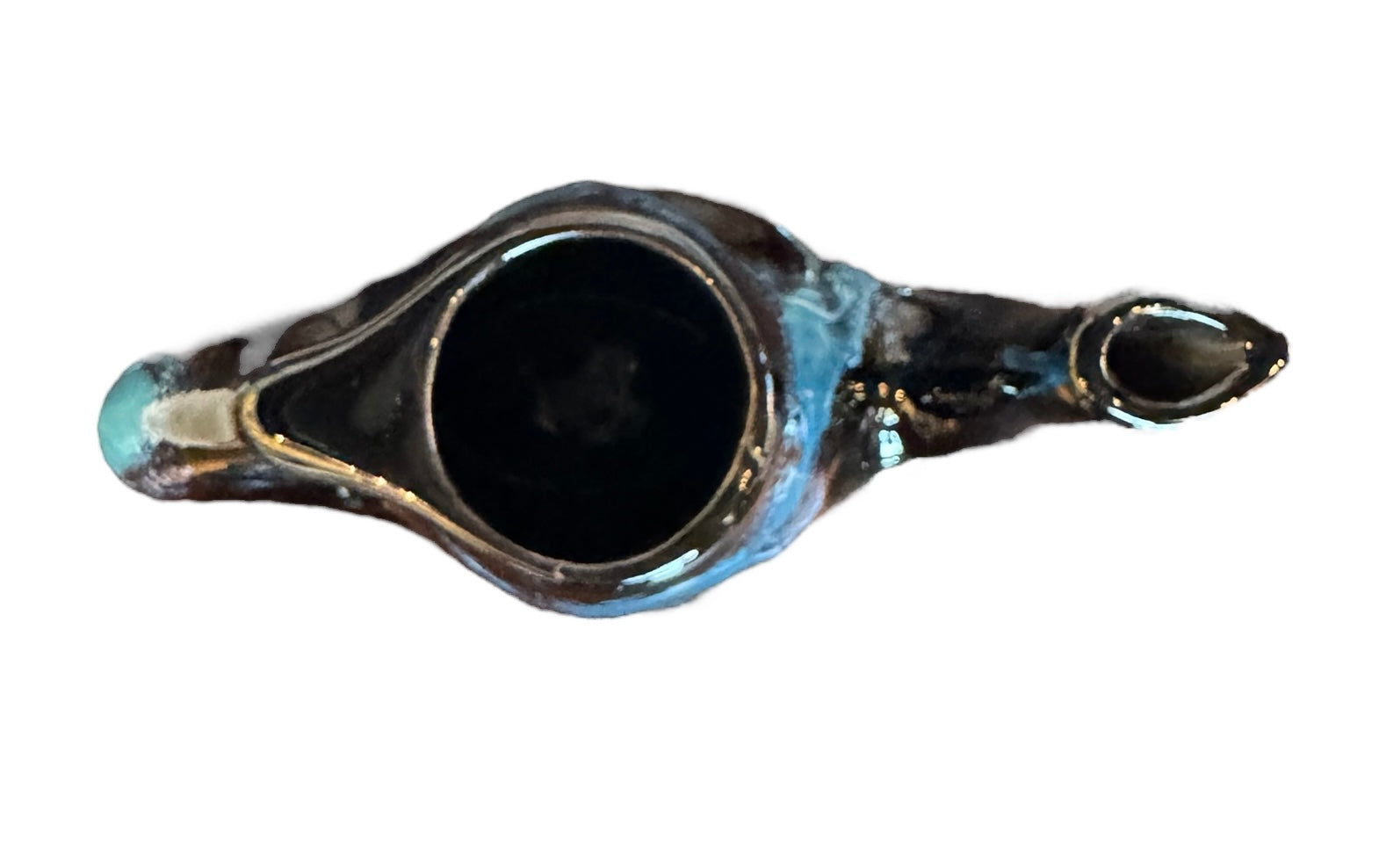 Complete mid-century ceramic tea set with teapot, sugar bowl, cups, and saucers, featuring a bold blue and black "lava drip" glaze reminiscent of Vallauris pottery.