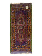 Anatolian Yastik rug with red, gold, green and gray geometric patterns and fringe.
