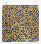 Patterned fabric with animals and flowers on a beige background