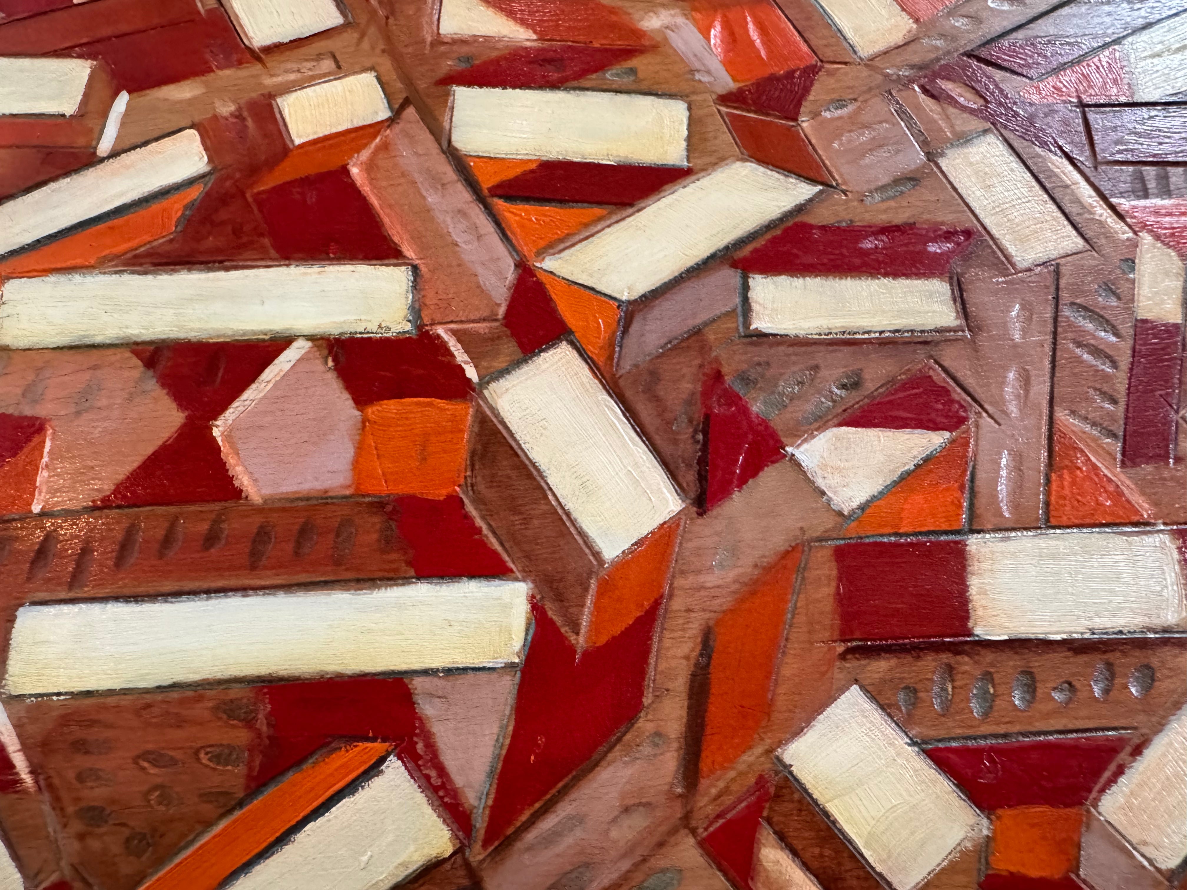Close-up of a mosaic pattern with geometric shapes in various wood tones.