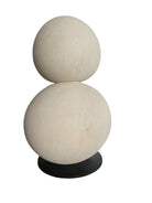 "Renzo Buttazzo's 'Lovers,' a sculpture made from Pietra Leccese featuring two stacked, rounded forms with subtle projections, on a black base."
"Modern sculpture of two smooth, light-colored forms stacked on top of each other, with a small horn-like protrusion on each."