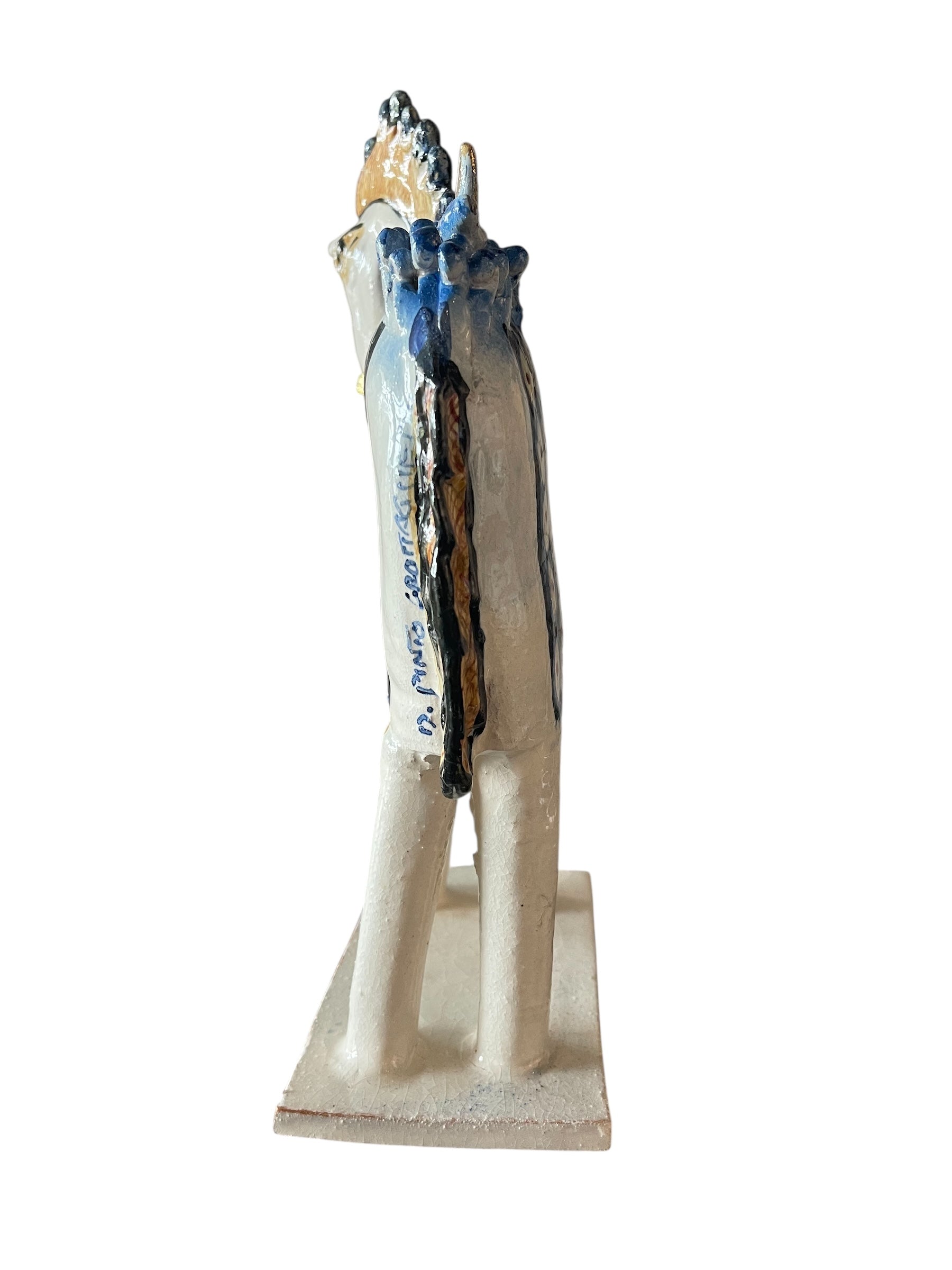 Ceramic horse by Domenico Pinto, featuring a white glazed body, geometric quilting on the saddle, gold accents, and 24Kt gold detailing. The horse stands on four legs and is placed on a white base.