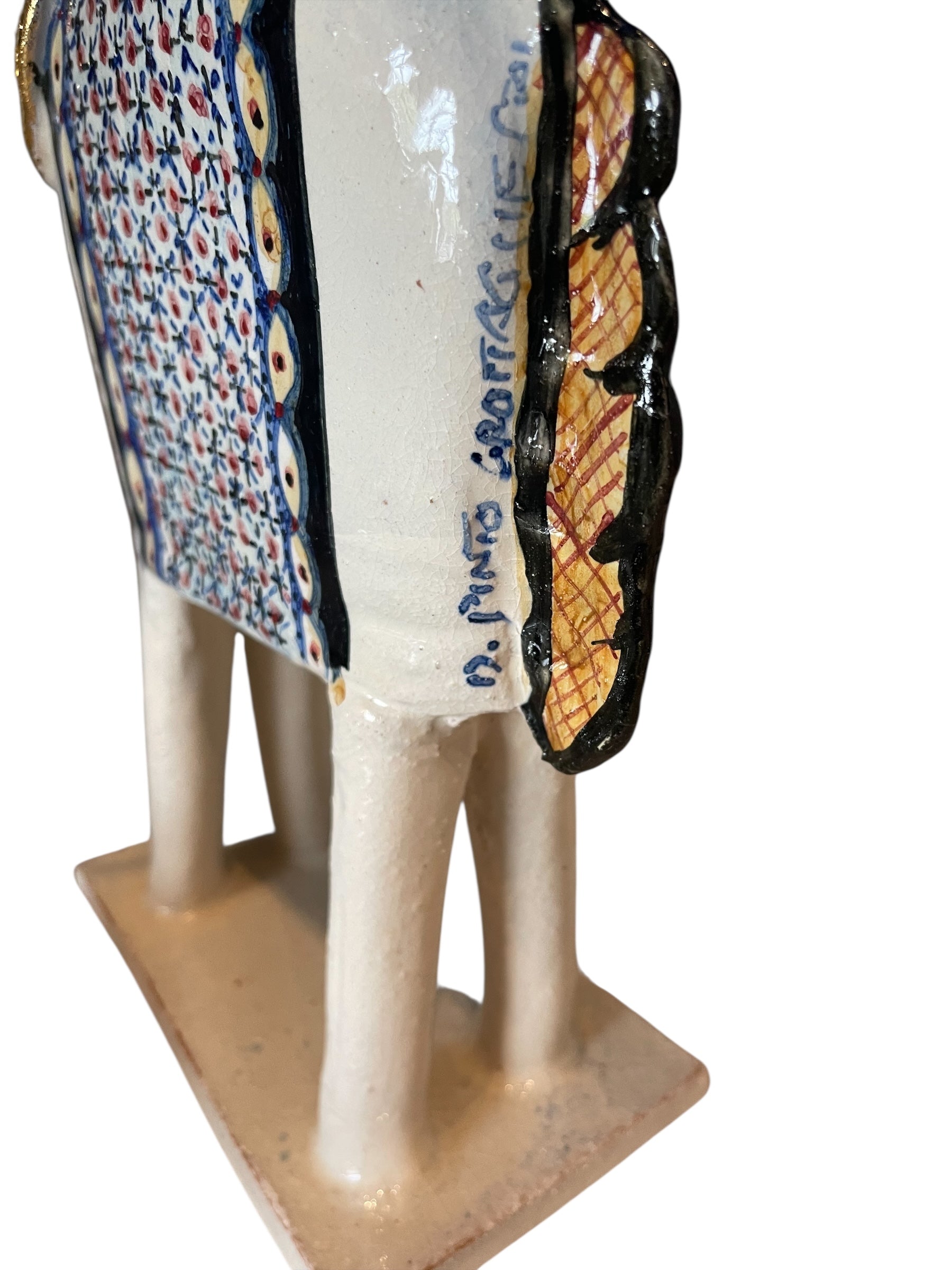 Ceramic horse by Domenico Pinto, featuring a white glazed body, geometric quilting on the saddle, gold accents, and 24Kt gold detailing. The horse stands on four legs and is placed on a white base.