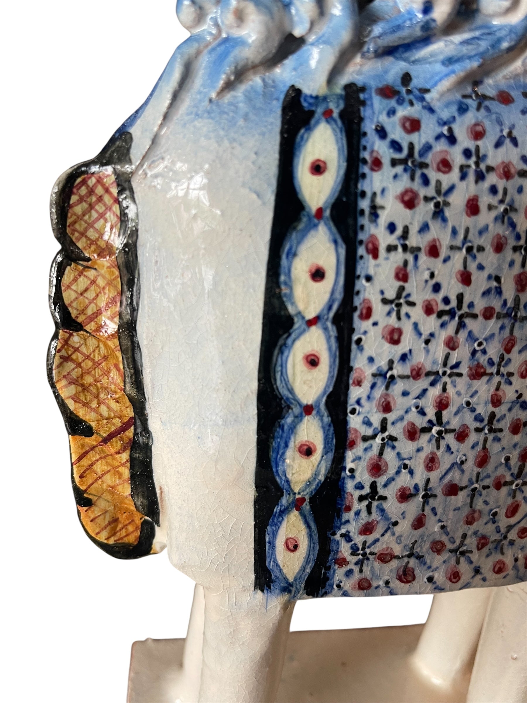 Ceramic horse by Domenico Pinto, featuring a white glazed body, geometric quilting on the saddle, gold accents, and 24Kt gold detailing. The horse stands on four legs and is placed on a white base.