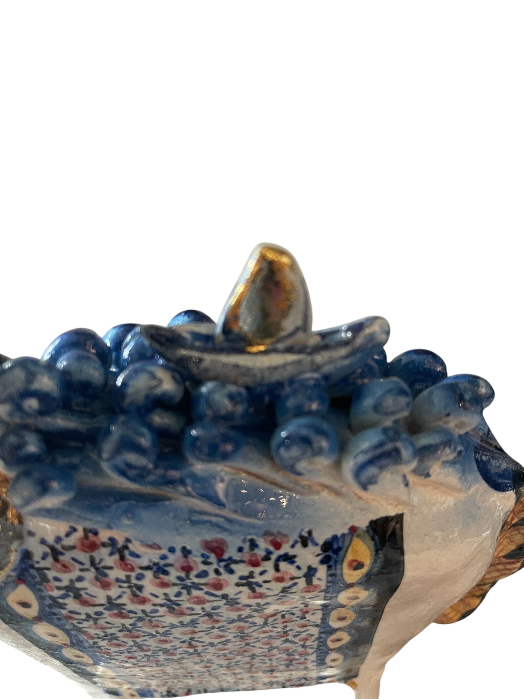 Ceramic horse by Domenico Pinto, featuring a white glazed body, geometric quilting on the saddle, gold accents, and 24Kt gold detailing. The horse stands on four legs and is placed on a white base.