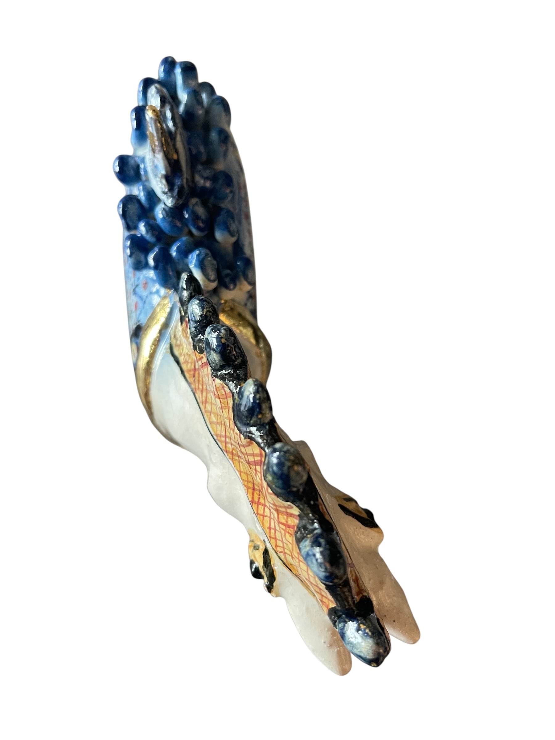Ceramic horse by Domenico Pinto, featuring a white glazed body, geometric quilting on the saddle, gold accents, and 24Kt gold detailing. The horse stands on four legs and is placed on a white base.