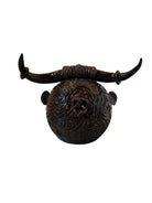 Glossy dark brown ceramic bull sculpture with intricate, hand-incised swirling patterns and a nose ring.