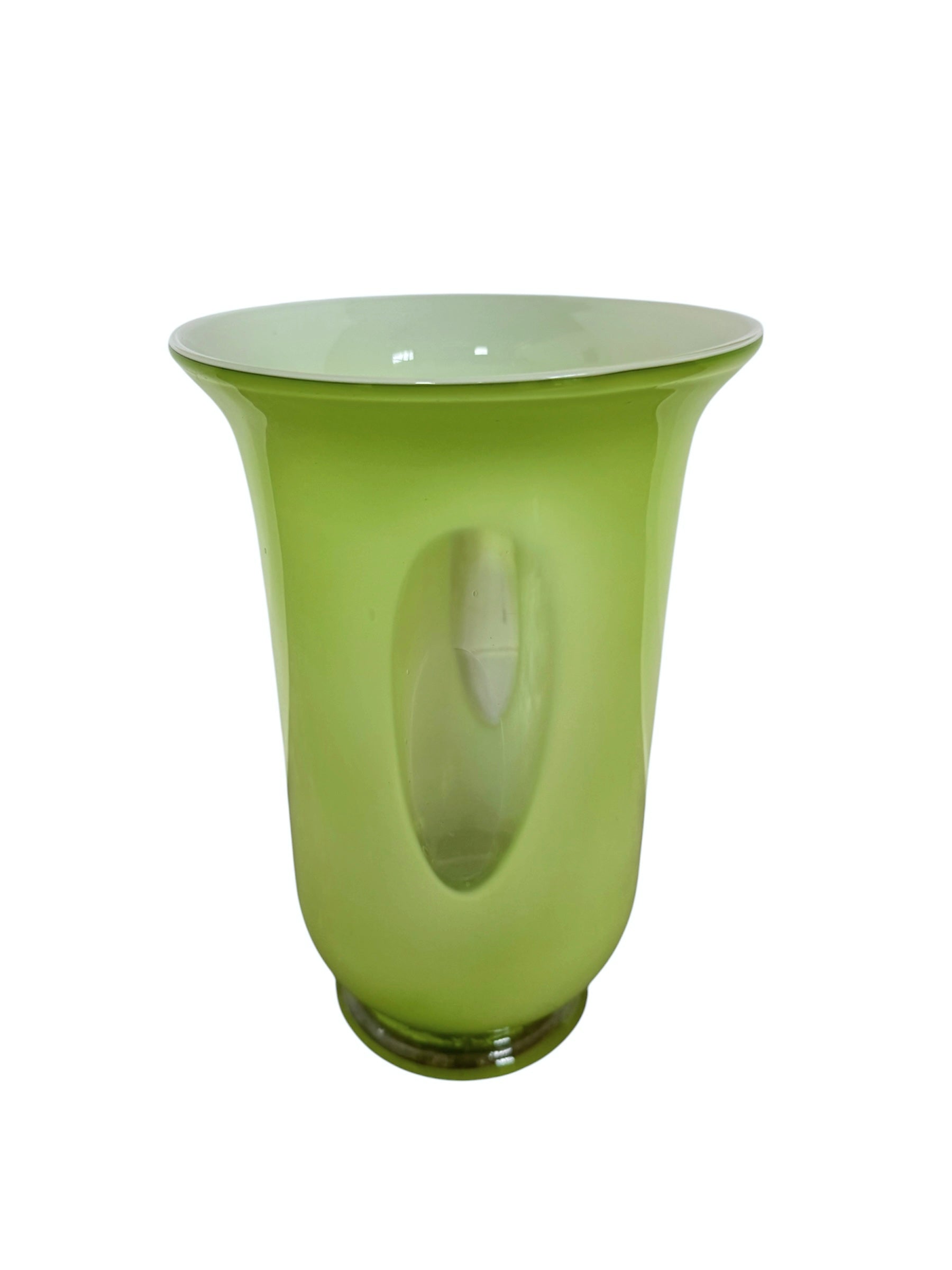 A mid-century modern, lime green cased-glass vase with a wide, flared rim and a thick, clear glass base. The exterior is a glossy chartreuse green, while the interior is lined with solid milk-white glass. The defining feature is a large, vertical oval cutout window that pierces directly through the center of the vase's body, creating an open-air negative space.