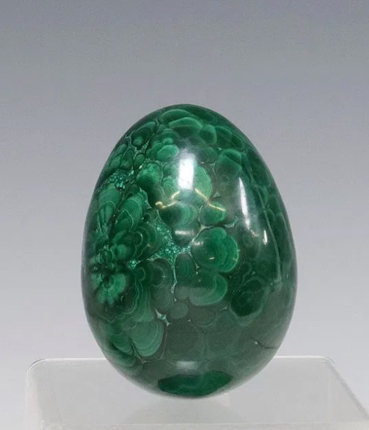 Malachite
Egg
Stone
Mineral
Polished
Green
Banded
Unique
Small
Petite
Specimen
Crystal
Smooth
Swirling
Patterns
Malachite specimen
Mineral inclusion
Banded patterns
Natural textures
Polished stone
Collector's item
Unique find
Rare specimen
Green hues
Mineral matrix