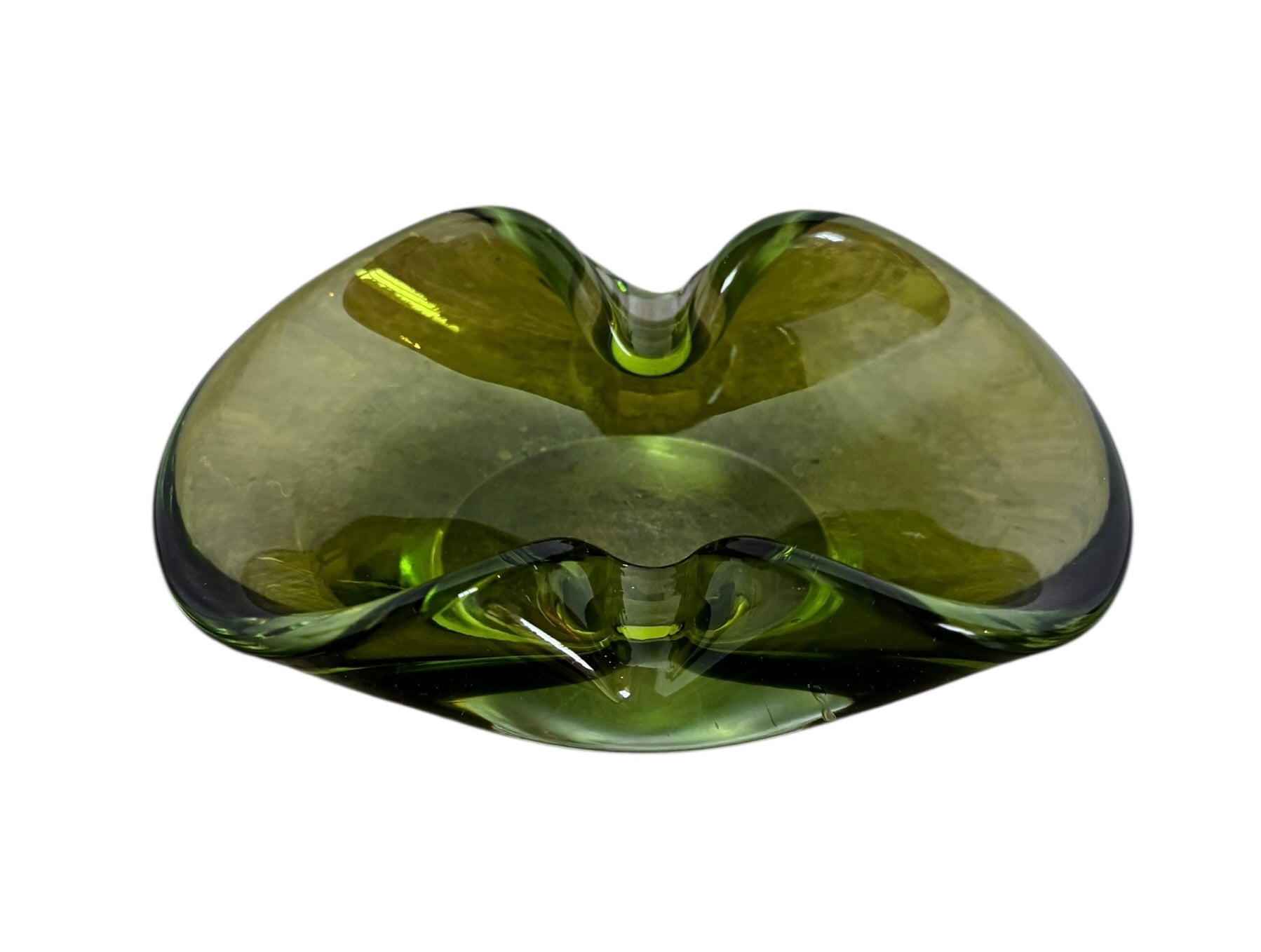 A vintage, Mid-Century Modern, peridot green Murano art glass ashtray or catchall bowl with a curved, free-form design.