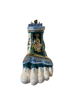 Close-up of Domenico Pinto's 'Mare Dentro' ceramic sculpture: foot, ship with gold sail, Apulian style