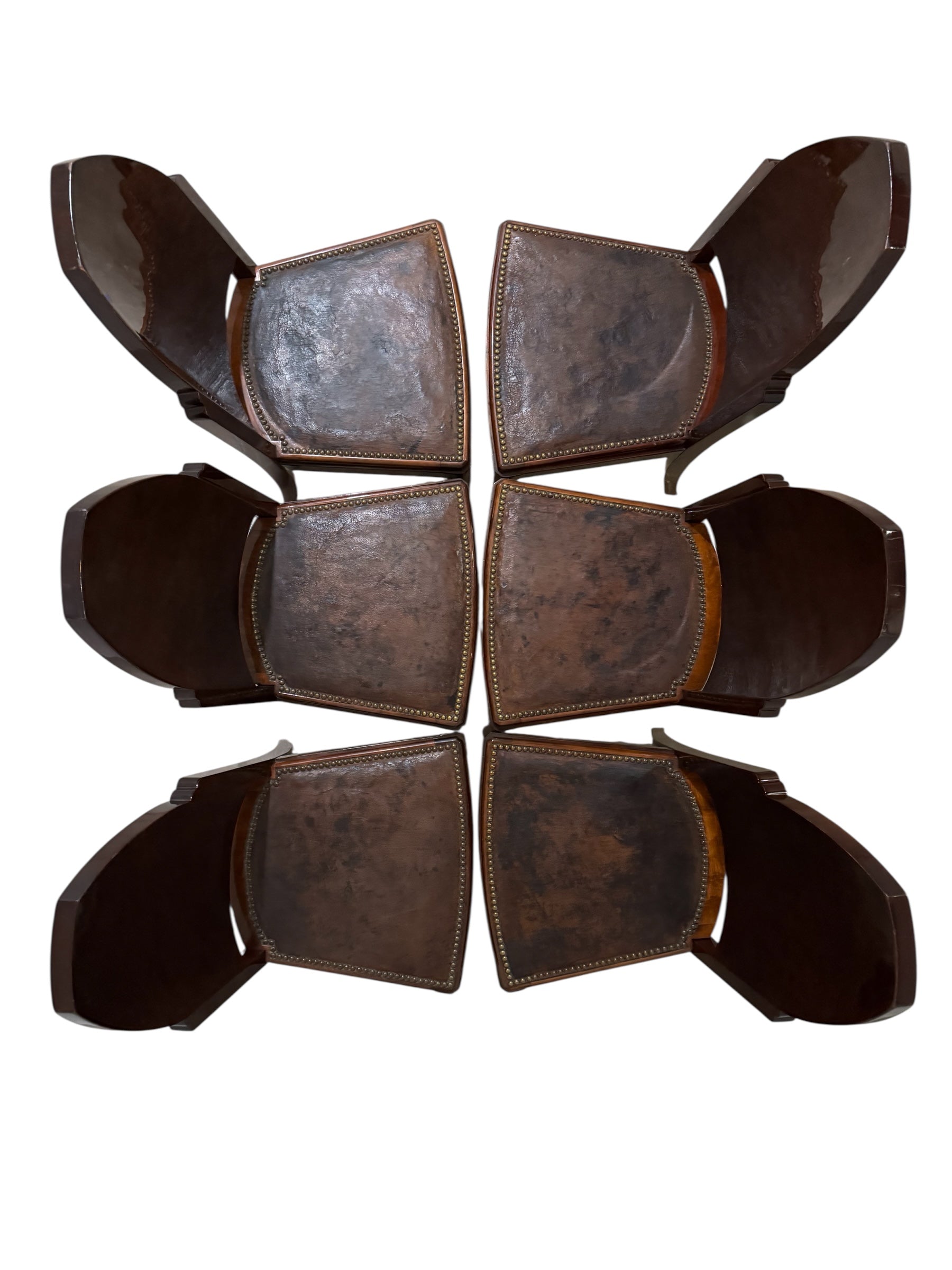  Art Deco chair featuring the leather upholstery, nail head trim, and mahogany frame.